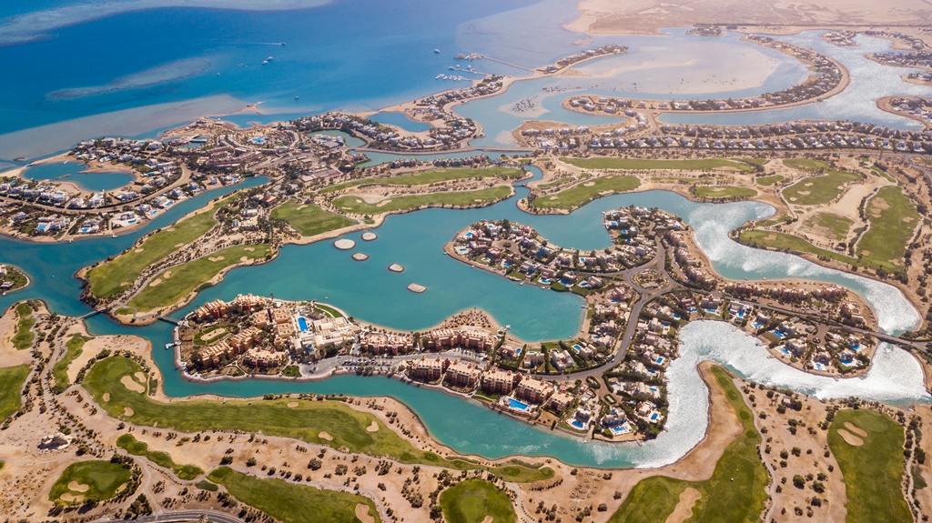 Beautiful_drone_overview_of_big_golf_course_with_lakes_by_tourists_town_El_Gouna_in_The_Red_Sea_Egypt.jpg
